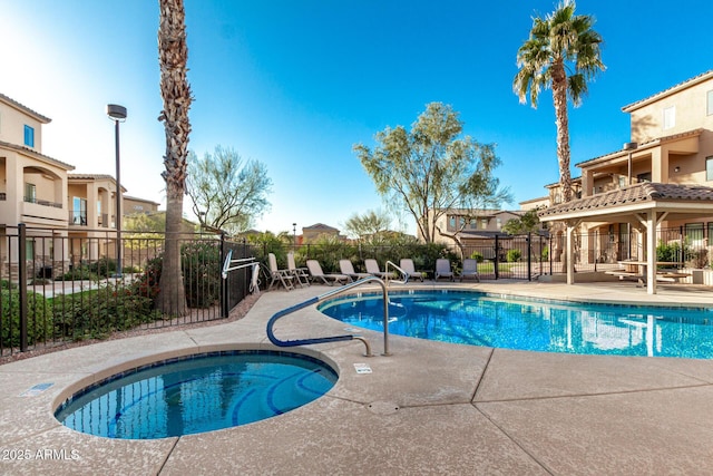 view of pool featuring a patio area and a community hot tub