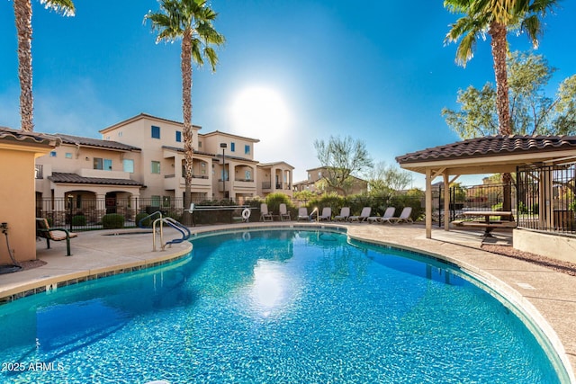 view of swimming pool with a patio area