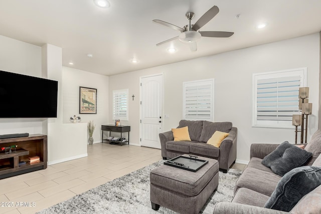 tiled living room featuring ceiling fan