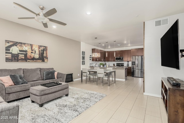 living room featuring ceiling fan