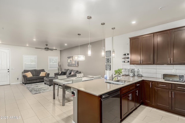 kitchen with ceiling fan, sink, black dishwasher, kitchen peninsula, and pendant lighting