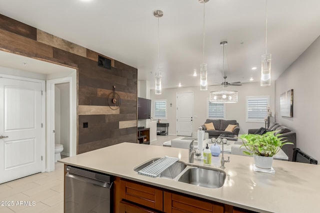 kitchen with a healthy amount of sunlight, ceiling fan, dishwasher, and pendant lighting