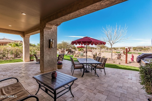 view of patio featuring outdoor dining area