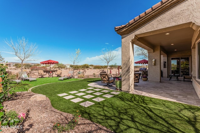 view of yard with a fenced backyard and a patio