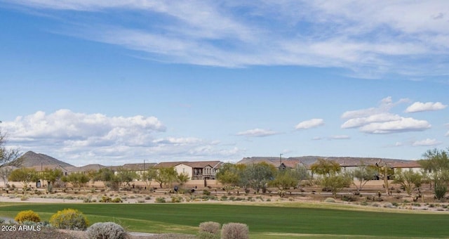 surrounding community featuring view of golf course, a lawn, and a mountain view