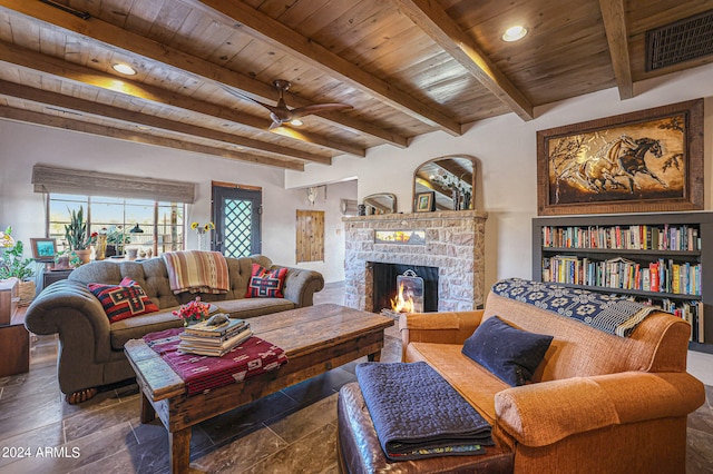 living room featuring tile patterned floors, a fireplace, beamed ceiling, and wooden ceiling