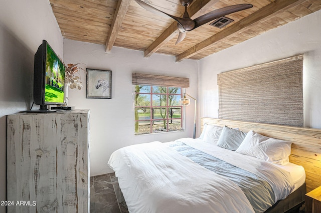 tiled bedroom featuring ceiling fan, beam ceiling, and wood ceiling