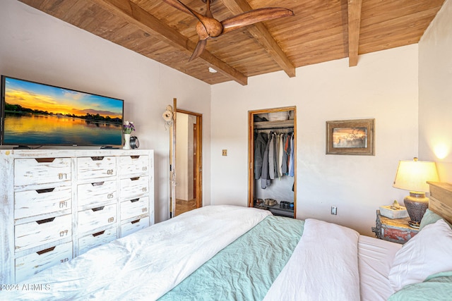 bedroom featuring wooden ceiling, a closet, and beamed ceiling