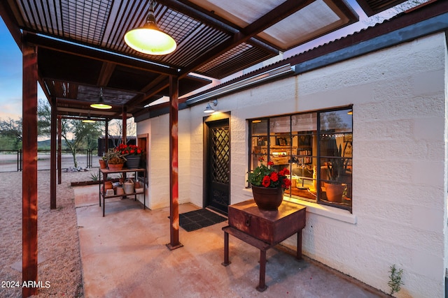 view of patio terrace at dusk