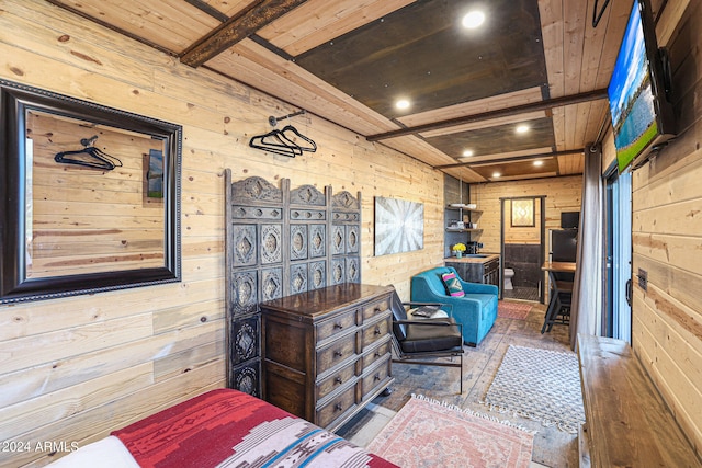 bedroom featuring wood walls, beam ceiling, wooden ceiling, and hardwood / wood-style flooring