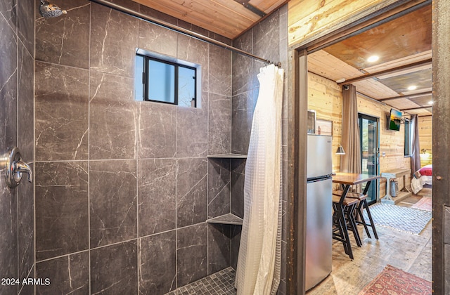 bathroom with a shower with shower curtain, wood walls, and wood ceiling