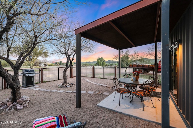 view of patio terrace at dusk