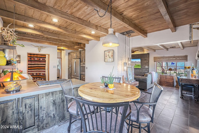 tiled dining area featuring wood ceiling and beam ceiling