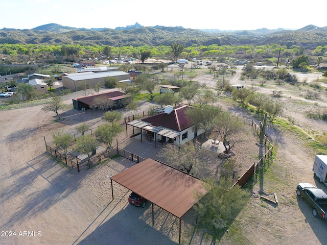 birds eye view of property with a mountain view