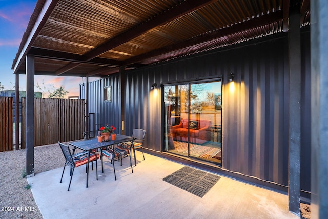 view of patio terrace at dusk