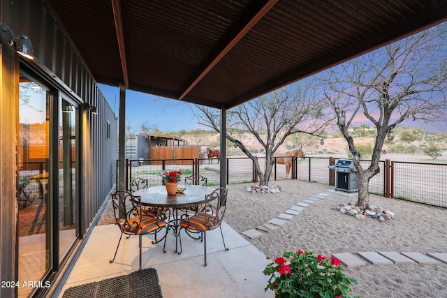 patio terrace at dusk with area for grilling