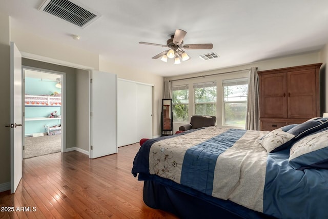 bedroom with ceiling fan, a closet, light wood-type flooring, and visible vents