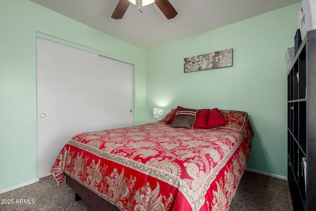 carpeted bedroom with a ceiling fan, a closet, and baseboards