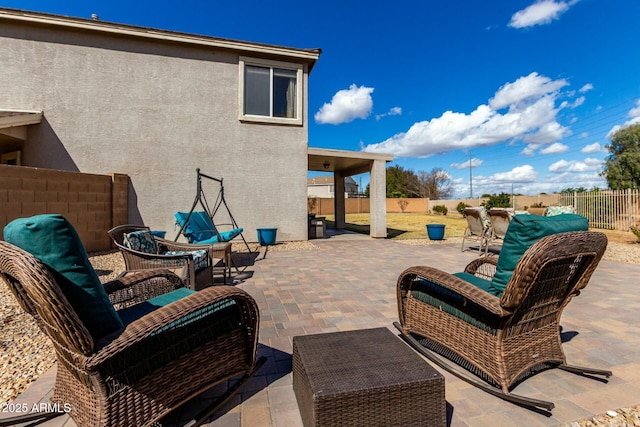 view of patio featuring a fenced backyard and an outdoor hangout area