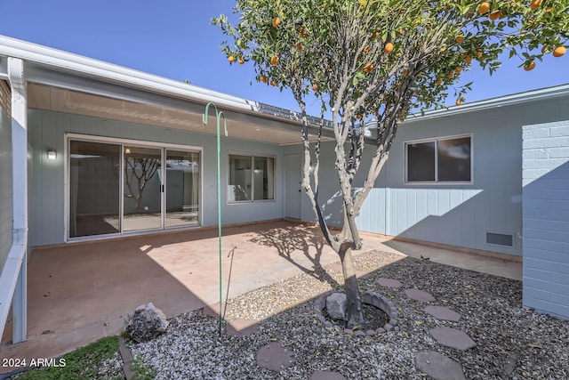 rear view of property featuring a patio area