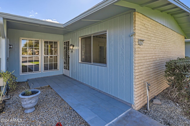 property entrance with a patio area