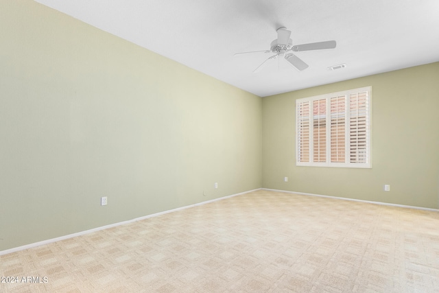 carpeted empty room with ceiling fan