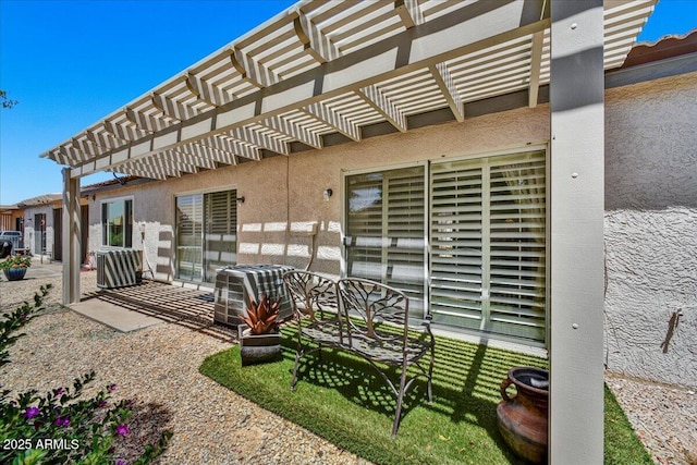view of patio featuring central AC and a pergola