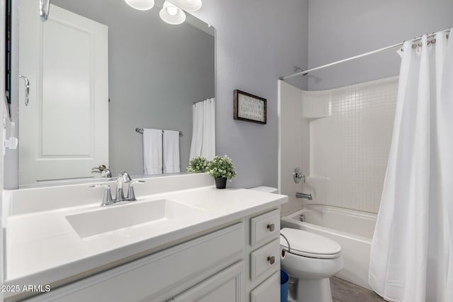 full bath featuring toilet, vanity, and shower / bath combination with curtain