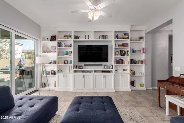 living area with ceiling fan and light tile patterned flooring