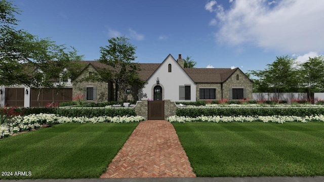 tudor home with a front yard