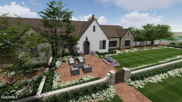 tudor home with an outdoor living space and a front lawn