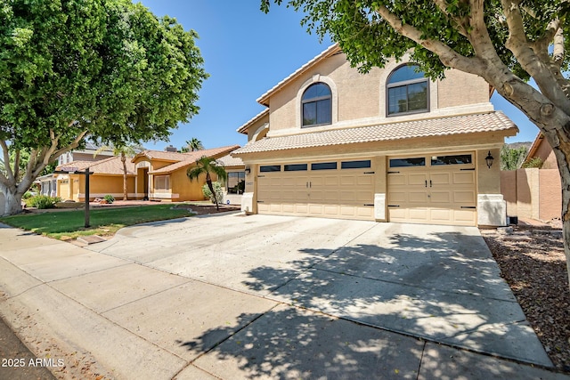 20657 N 56th Ave, Glendale, AZ 85308 - view of front of house featuring concrete driveway, stucco siding, a tiled roof, and an attached garage