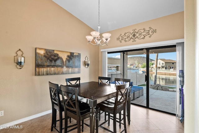 20657 N 56th Ave, Glendale, AZ 85308 - dining space with high vaulted ceiling, a chandelier, and light tile patterned floors