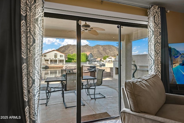 20657 N 56th Ave, Glendale, AZ 85308 - doorway to outside featuring a mountain view, a ceiling fan, and a residential view