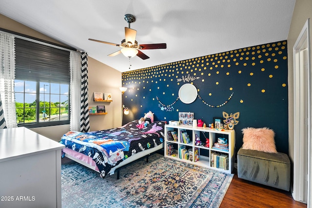 20657 N 56th Ave, Glendale, AZ 85308 - bedroom featuring wood finished floors, ceiling fan, and an accent wall