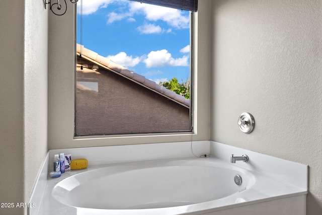 20657 N 56th Ave, Glendale, AZ 85308 - bathroom featuring plenty of natural light, a garden tub, and a textured wall
