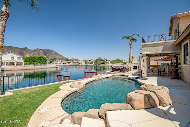 20657 N 56th Ave, Glendale, AZ 85308 - view of pool with a water and mountain view, ceiling fan, a fenced backyard, and a patio