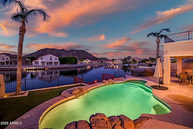20657 N 56th Ave, Glendale, AZ 85308 - pool at dusk with a patio and a water and mountain view