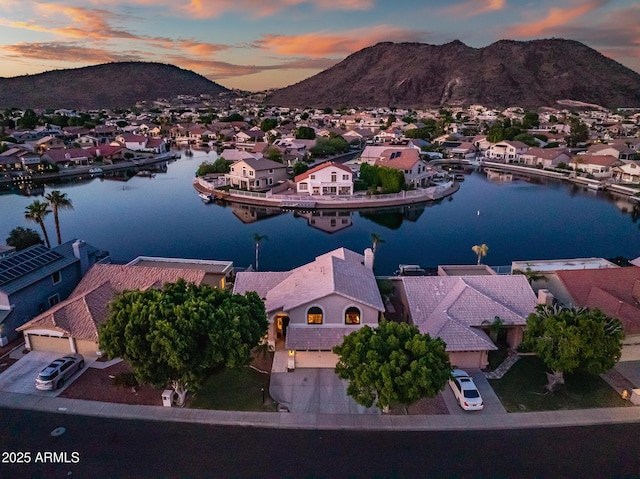 20657 N 56th Ave, Glendale, AZ 85308 - aerial view at dusk of a residential view and a water and mountain view