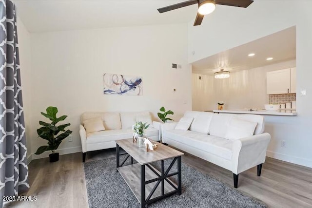623 W Guadalupe Rd Unit 288, Mesa, AZ 85210 - living room featuring wood finished floors, a ceiling fan, baseboards, and high vaulted ceiling