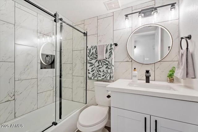 623 W Guadalupe Rd Unit 288, Mesa, AZ 85210 - bathroom with tile walls, vanity, toilet, enclosed tub / shower combo, and backsplash