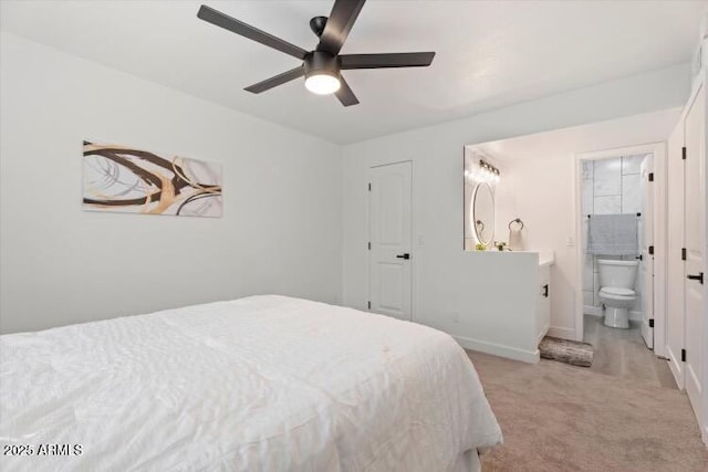 623 W Guadalupe Rd Unit 288, Mesa, AZ 85210 - bedroom featuring light colored carpet, baseboards, ensuite bathroom, and a ceiling fan