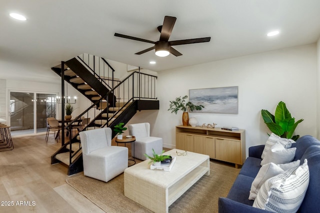 living room featuring ceiling fan, stairway, recessed lighting, and light wood-style floors