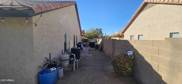 view of side of home featuring cooling unit