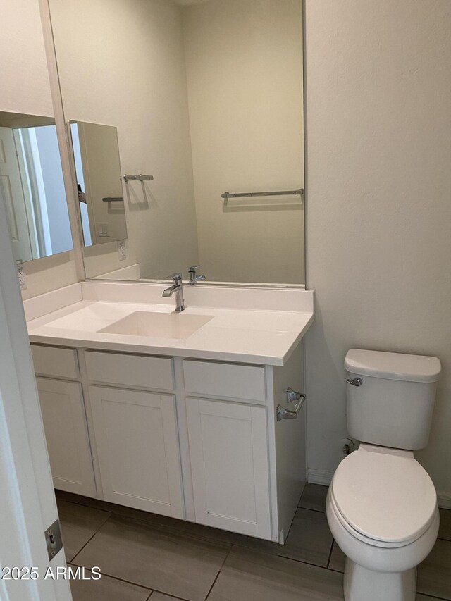 2181 N 211th Dr, Buckeye, AZ 85396 - bathroom with vanity, tile patterned floors, and toilet