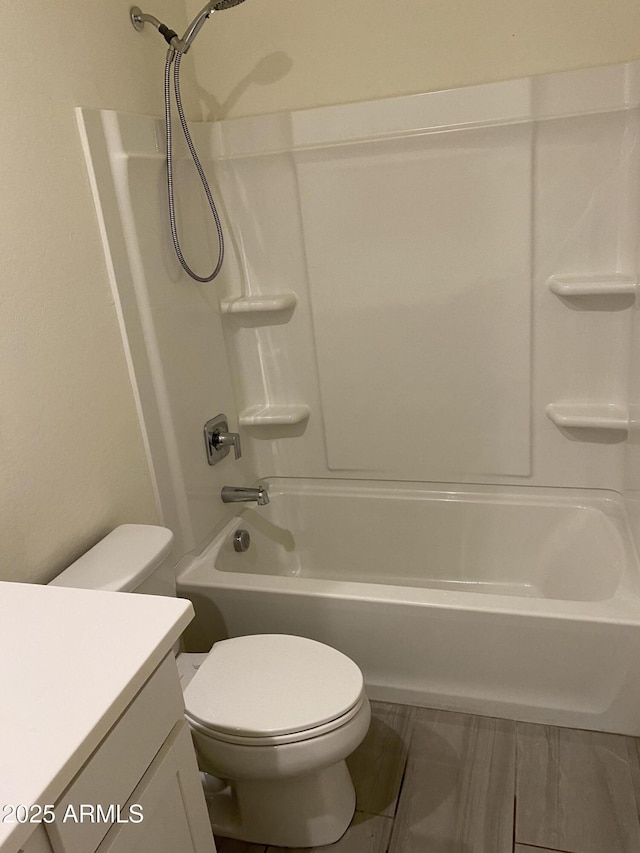 2181 N 211th Dr, Buckeye, AZ 85396 - bathroom featuring vanity, toilet, and bathing tub / shower combination
