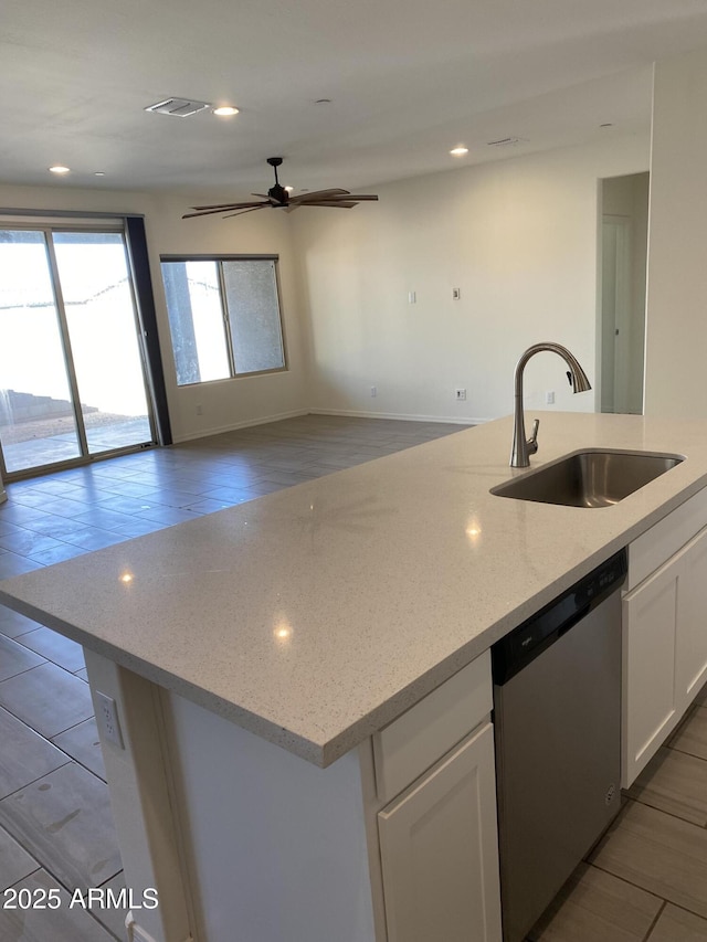 2181 N 211th Dr, Buckeye, AZ 85396 - kitchen featuring a sink, dishwasher, white cabinetry, light stone countertops, and recessed lighting