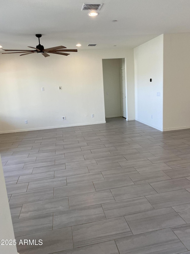 2181 N 211th Dr, Buckeye, AZ 85396 - empty room featuring ceiling fan, baseboards, and recessed lighting