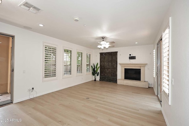 3931 E Crest Ln, Phoenix, AZ 85050 - unfurnished living room featuring light wood-style flooring, a fireplace, ceiling fan, baseboards, and recessed lighting