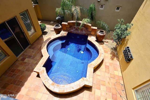 3931 E Crest Ln, Phoenix, AZ 85050 - view of swimming pool with a jacuzzi and a patio